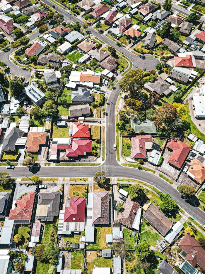 Drone shot of a vibrant Melbourne suburb showcasing houses and streets from above.